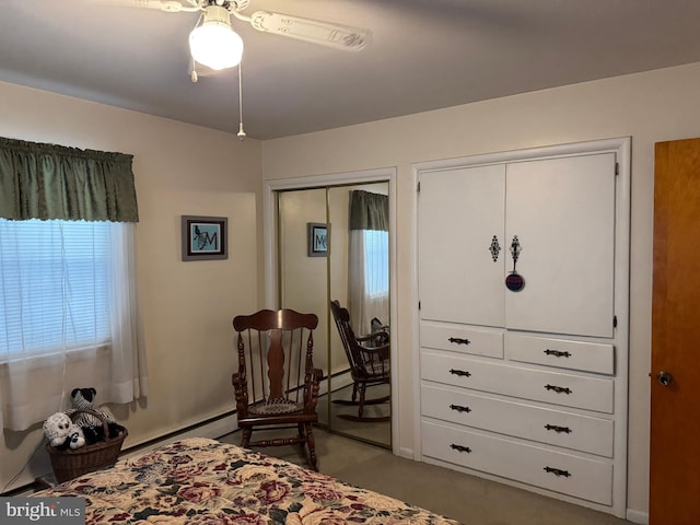 bedroom with baseboard heating and ceiling fan