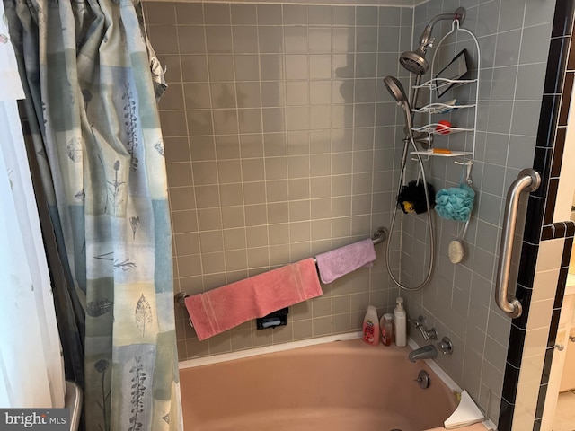 bathroom with shower / bath combo with shower curtain