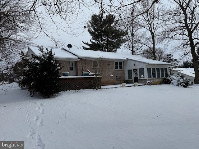 view of snow covered house