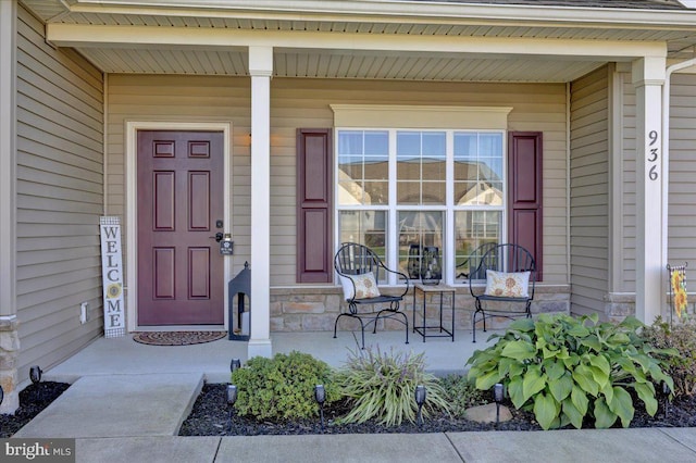 property entrance featuring covered porch