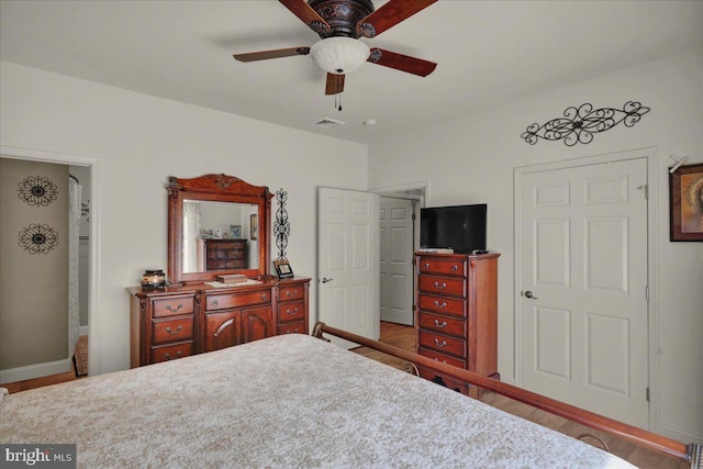 bedroom with ceiling fan and light hardwood / wood-style flooring