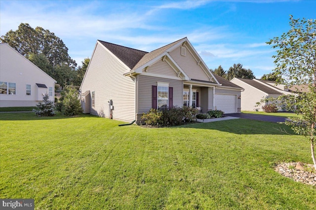 view of front of property featuring a garage and a front yard