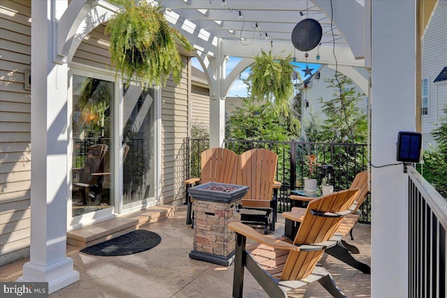 view of patio featuring a fire pit and a pergola