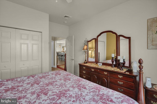 bedroom featuring ceiling fan and a closet