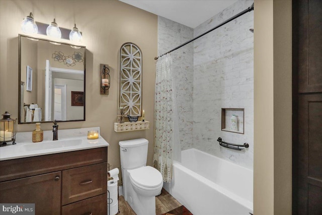 full bathroom with shower / tub combo with curtain, vanity, hardwood / wood-style floors, and toilet