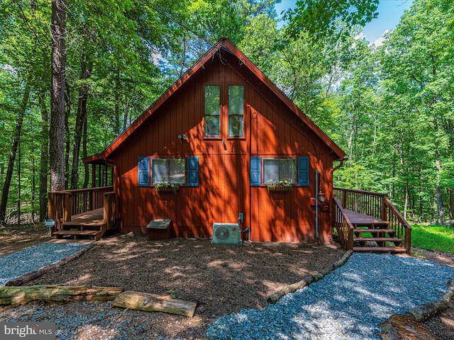 view of side of property featuring a deck