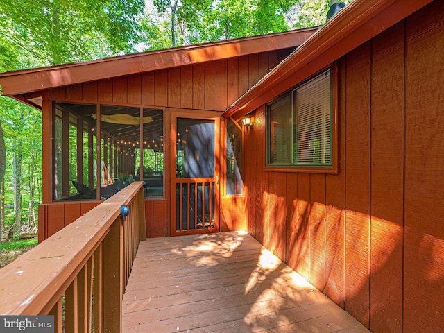 wooden terrace with a sunroom