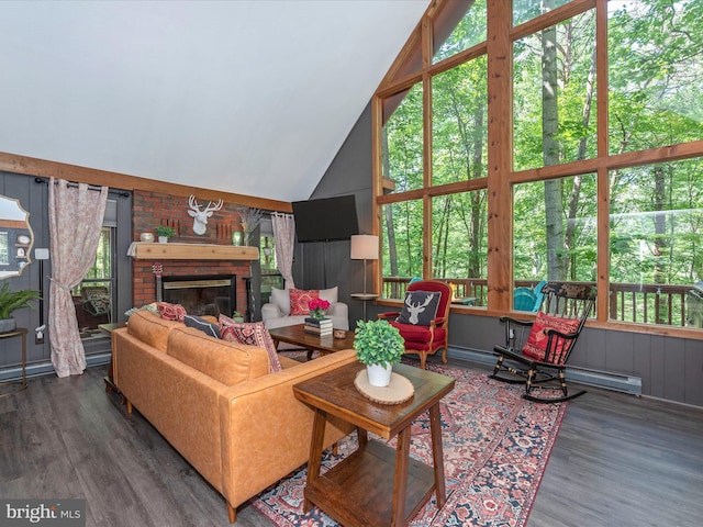 living room featuring a baseboard heating unit, high vaulted ceiling, dark hardwood / wood-style floors, and a fireplace