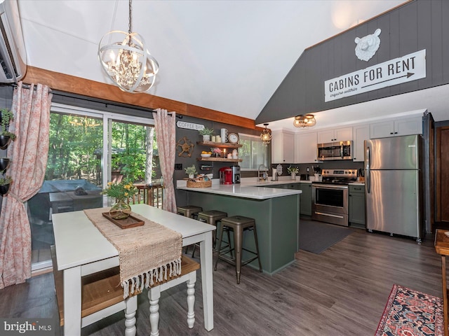 dining space featuring high vaulted ceiling, sink, a notable chandelier, and dark hardwood / wood-style floors