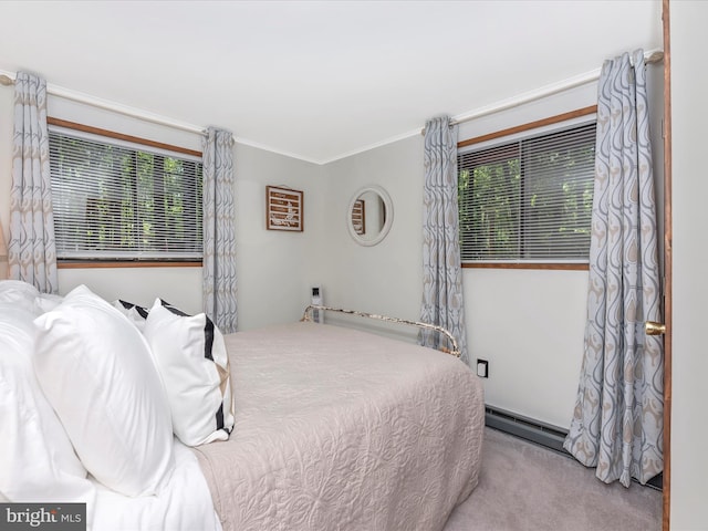 carpeted bedroom with crown molding and a baseboard radiator