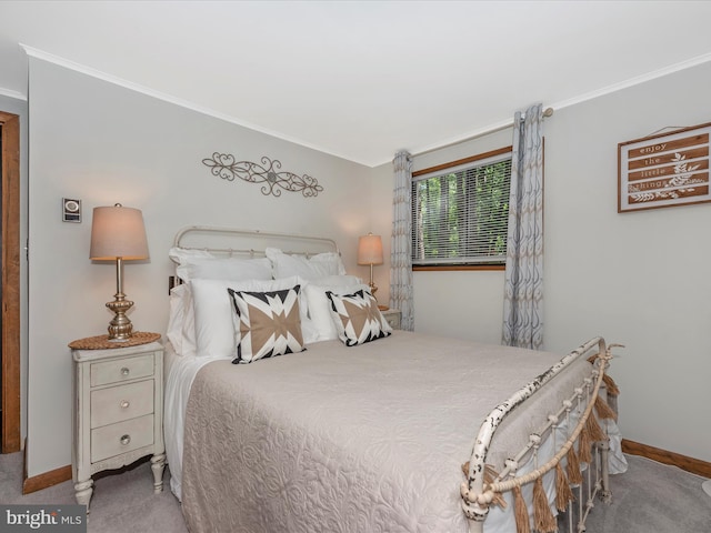 carpeted bedroom with ornamental molding