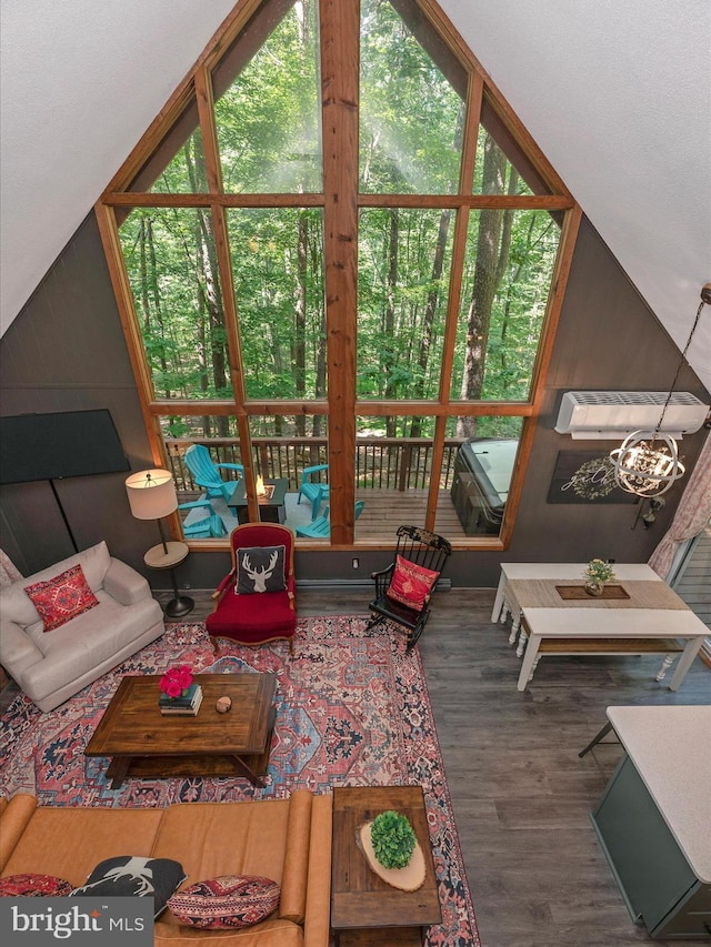 living room with vaulted ceiling and hardwood / wood-style floors