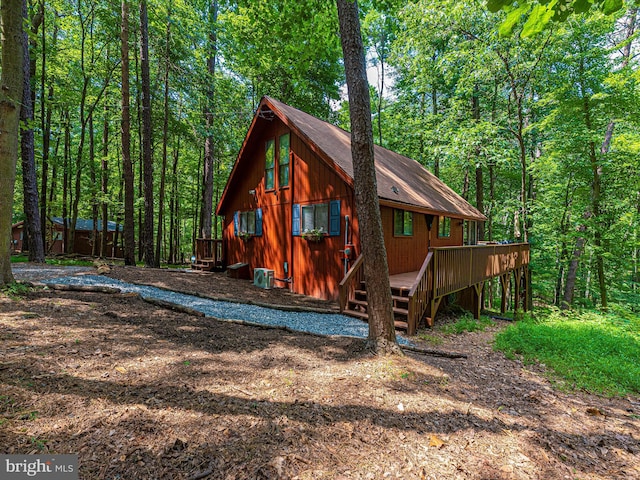 exterior space with a deck and central air condition unit