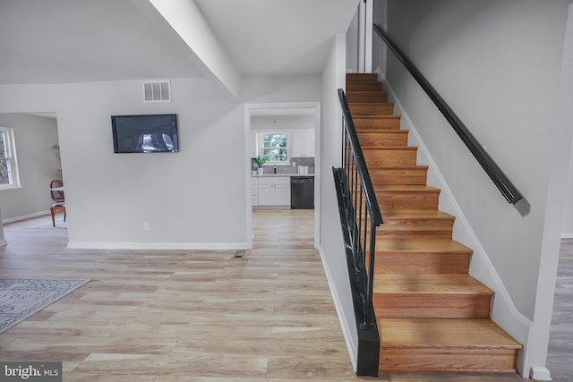 stairway with wood-type flooring