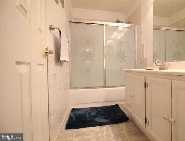 bathroom with enclosed tub / shower combo and vanity