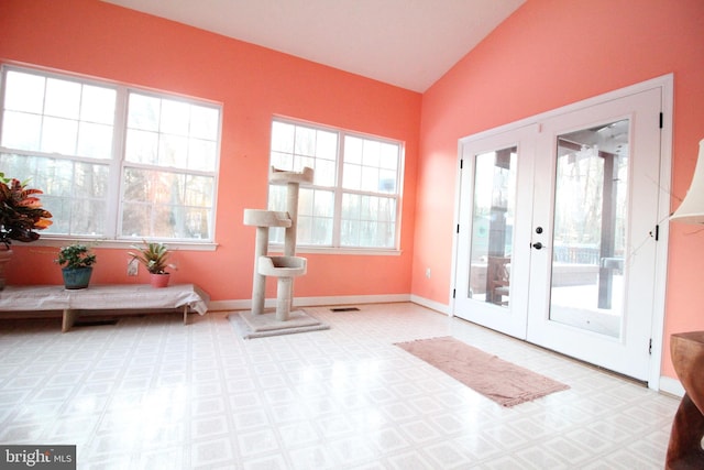 doorway featuring vaulted ceiling and french doors