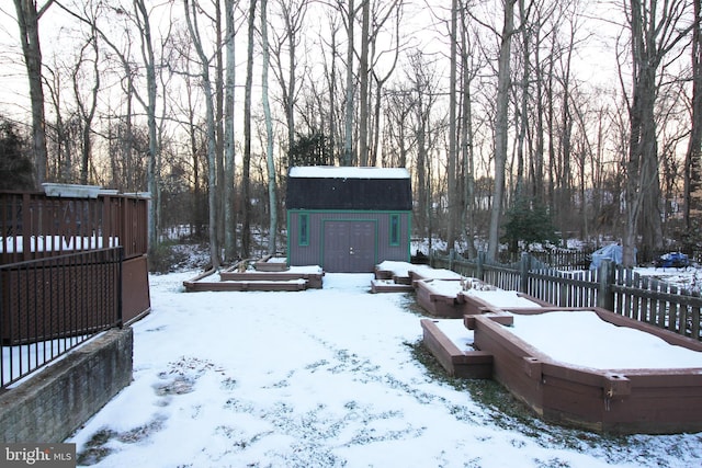 snowy yard with an outdoor structure