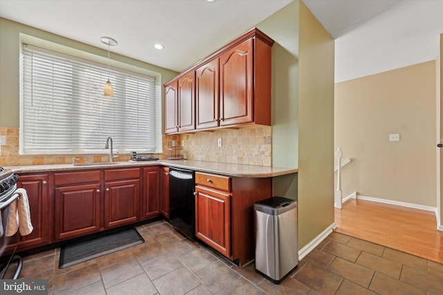 kitchen featuring dishwasher, sink, backsplash, hanging light fixtures, and light stone countertops