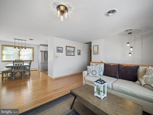 living room with light hardwood / wood-style flooring