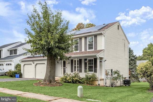 view of front of property with a porch, a garage, central air condition unit, solar panels, and a front lawn