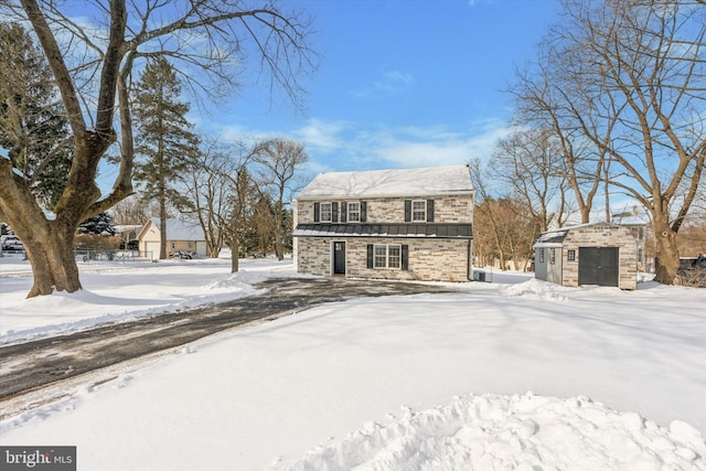 view of front facade with a garage and an outdoor structure