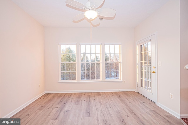 empty room featuring light hardwood / wood-style floors and ceiling fan