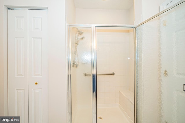 bathroom featuring an enclosed shower