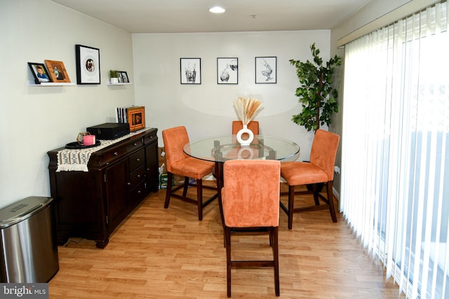 dining space featuring light wood-type flooring