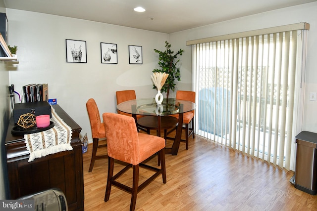 dining area with light hardwood / wood-style floors