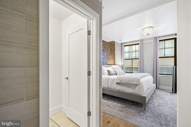 bedroom with light wood-type flooring