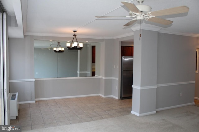 unfurnished room with ceiling fan with notable chandelier, light colored carpet, radiator heating unit, and ornamental molding