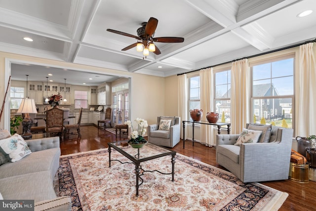 living room featuring dark wood-type flooring, coffered ceiling, beam ceiling, and a wealth of natural light