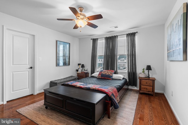 bedroom featuring hardwood / wood-style floors and ceiling fan