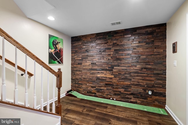 stairs with hardwood / wood-style flooring