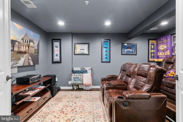 cinema room with hardwood / wood-style floors