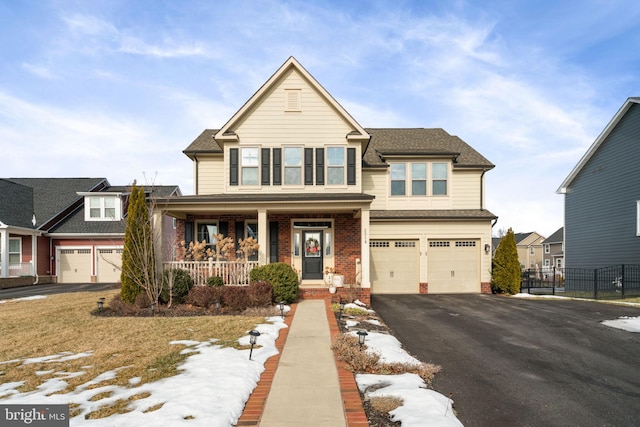 view of front of property with a garage and covered porch