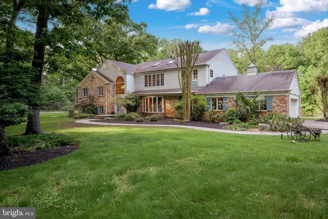 view of front of home with a front lawn