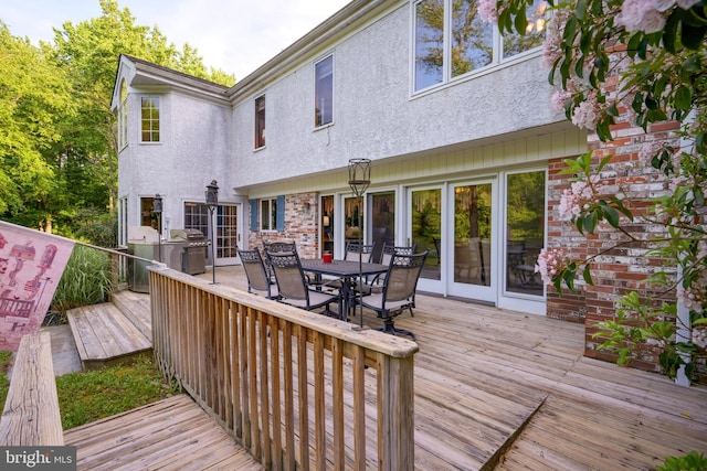 wooden deck with grilling area