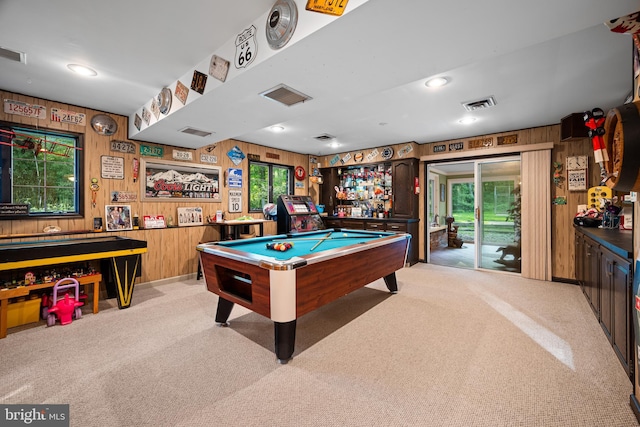 playroom with light colored carpet, pool table, and wooden walls