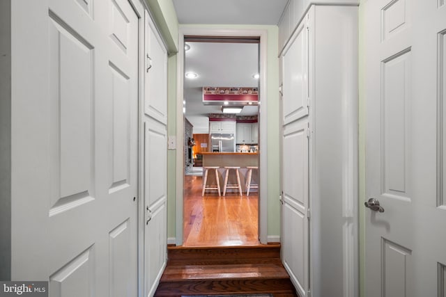 hallway featuring dark wood-type flooring