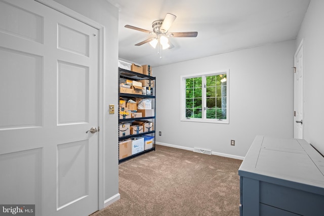 interior space featuring ceiling fan