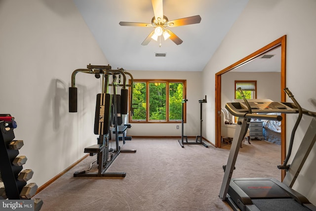 workout area with vaulted ceiling, ceiling fan, and light carpet