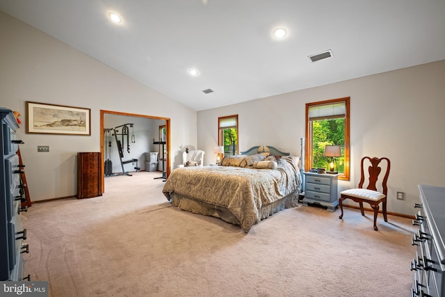 carpeted bedroom featuring high vaulted ceiling