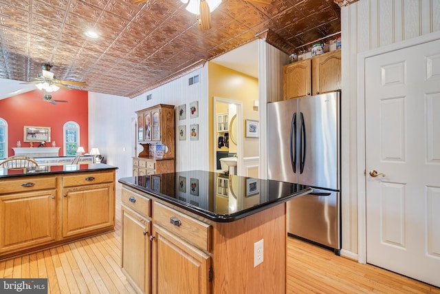 kitchen with an ornate ceiling, a ceiling fan, and freestanding refrigerator