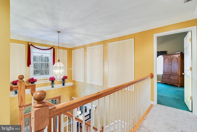 hall featuring visible vents, an upstairs landing, carpet, and an inviting chandelier