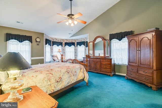 bedroom with vaulted ceiling, multiple windows, visible vents, and carpet floors