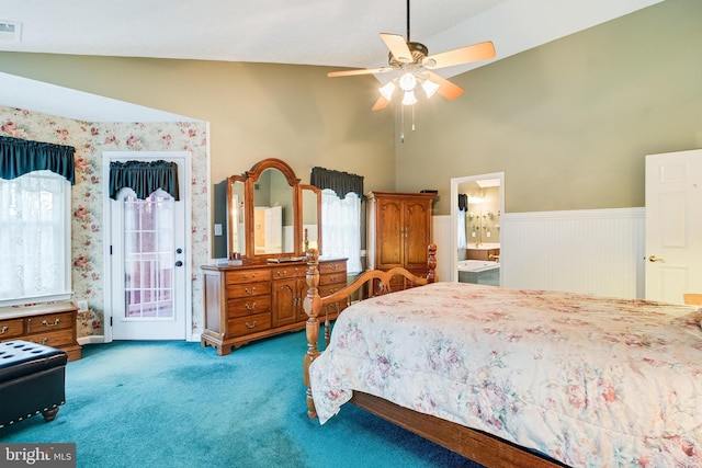 bedroom with multiple windows, access to outside, carpet flooring, wainscoting, and vaulted ceiling