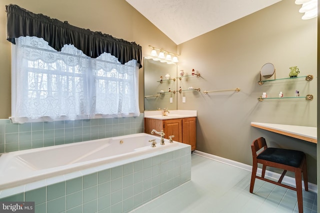 full bath featuring baseboards, a garden tub, vanity, and lofted ceiling