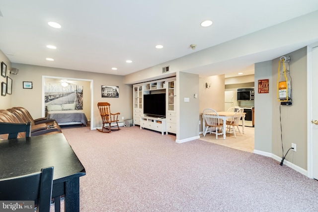 carpeted living area with recessed lighting, visible vents, and baseboards