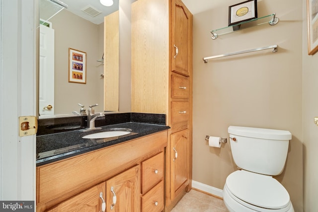 bathroom featuring tile patterned floors, visible vents, toilet, and vanity